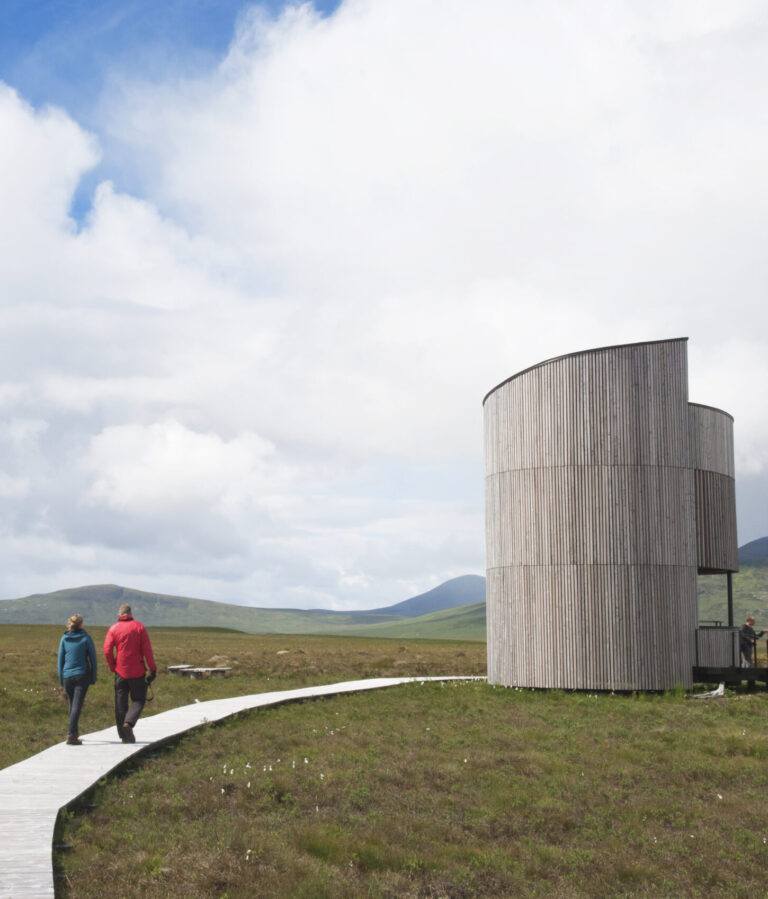 People walking along trail to Forsinard lookout tower