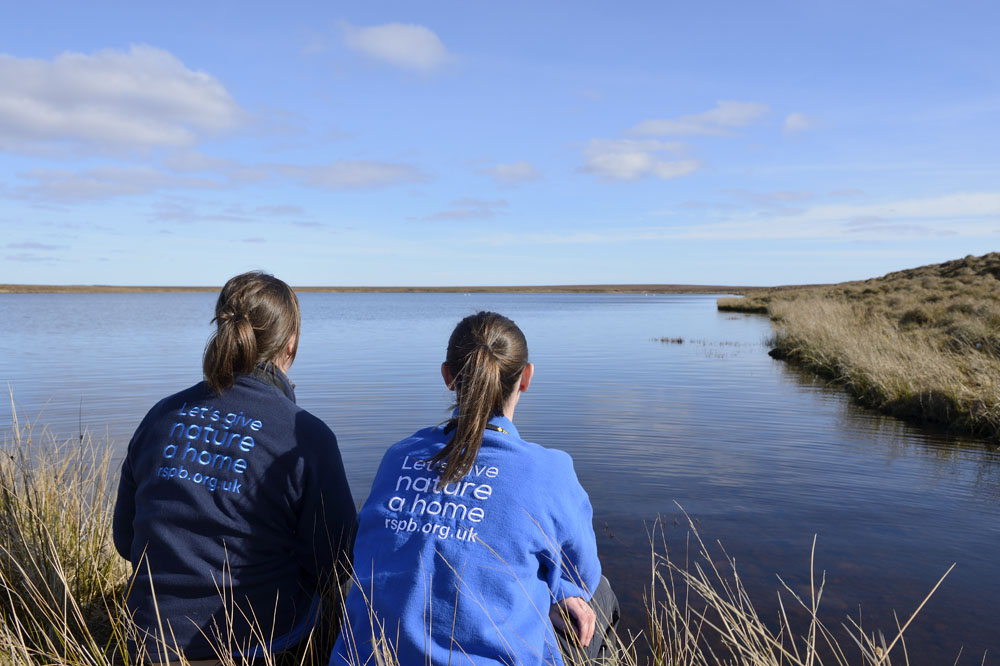 Women looking out over lake