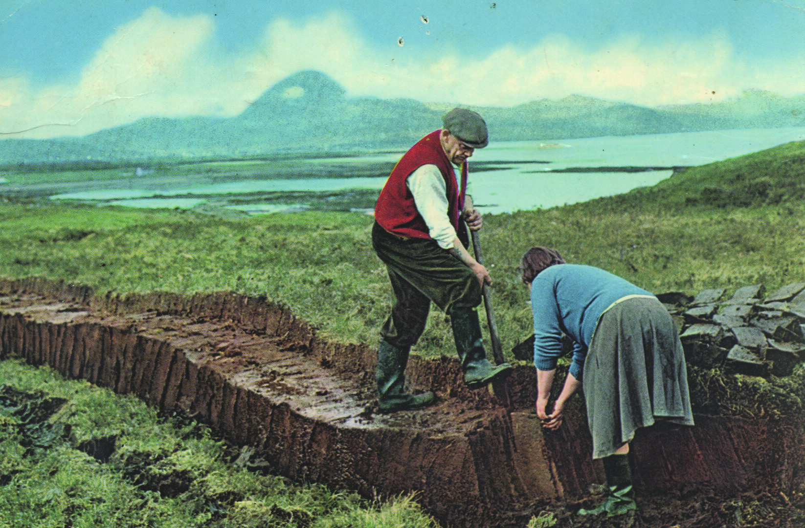 Two people cut peat in the Flow Country.
